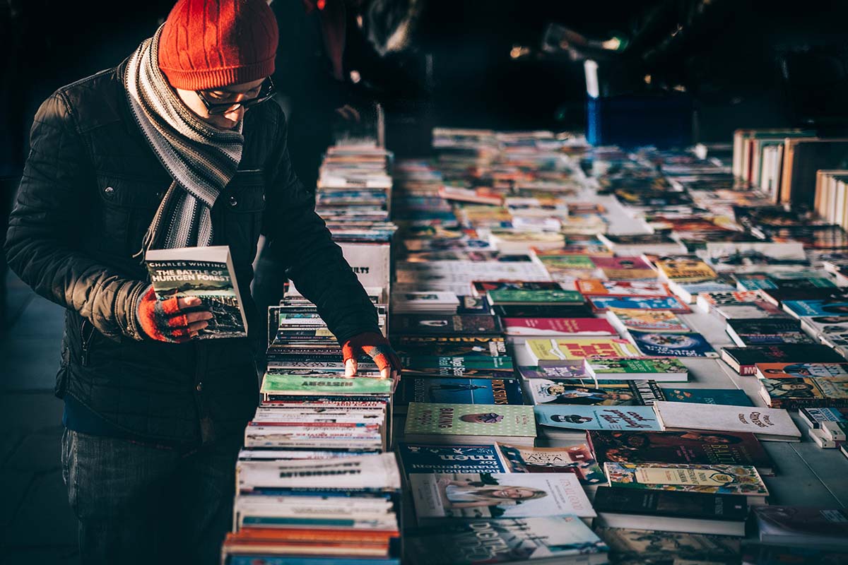 A man at a book stall. Thanks to Clem Onojeghuo from Unsplash for the image.